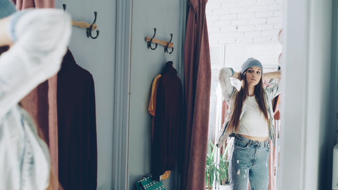 Woman trying on clothes in a dressing room