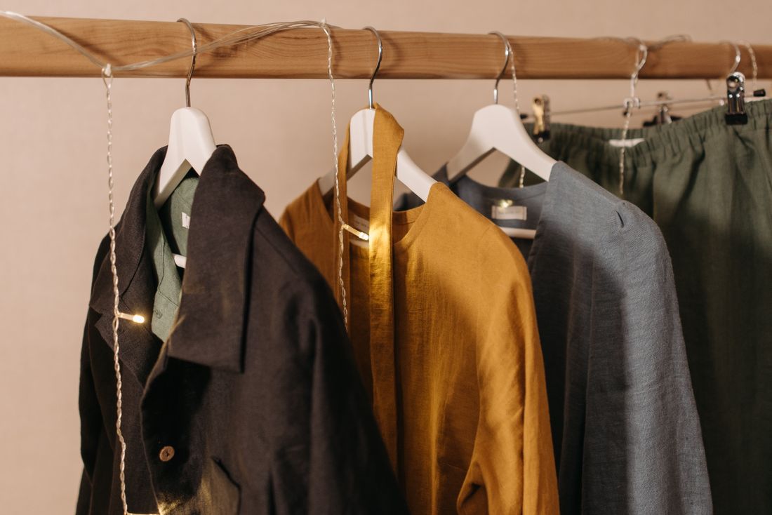 Clothes hanging on a wooden rack