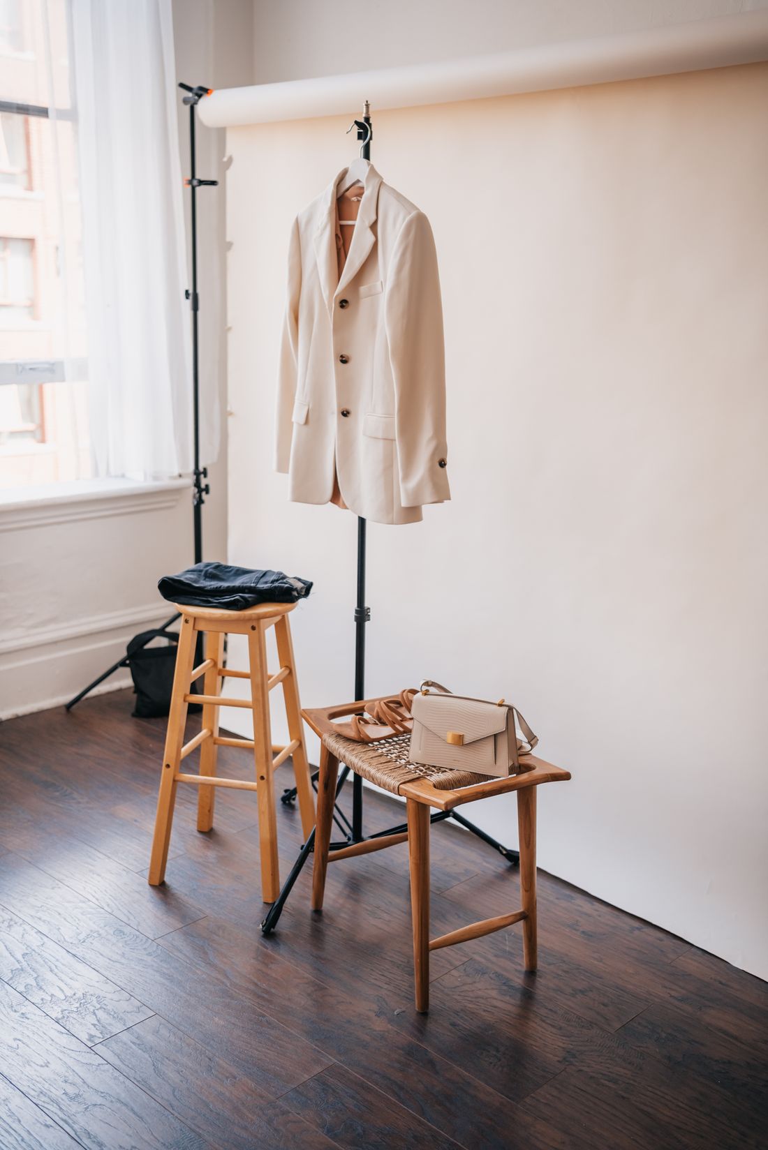 Beige blazer hanging on a clothes hanger